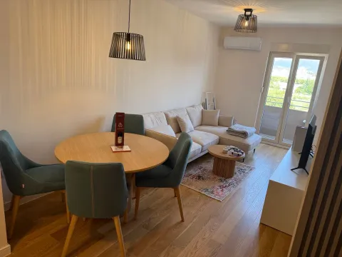 Living room with dining area and sofa set. - image 3