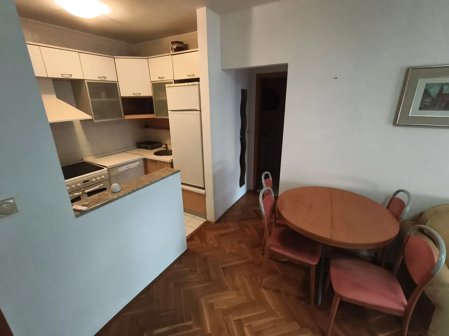 Small kitchen connected to the dining and living area.