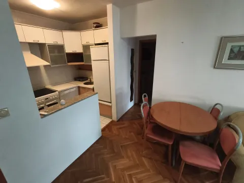 Small kitchen connected to the dining and living area. - image 2