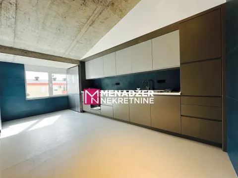 Modern kitchen with fitted cabinets in an attic space. - image 9