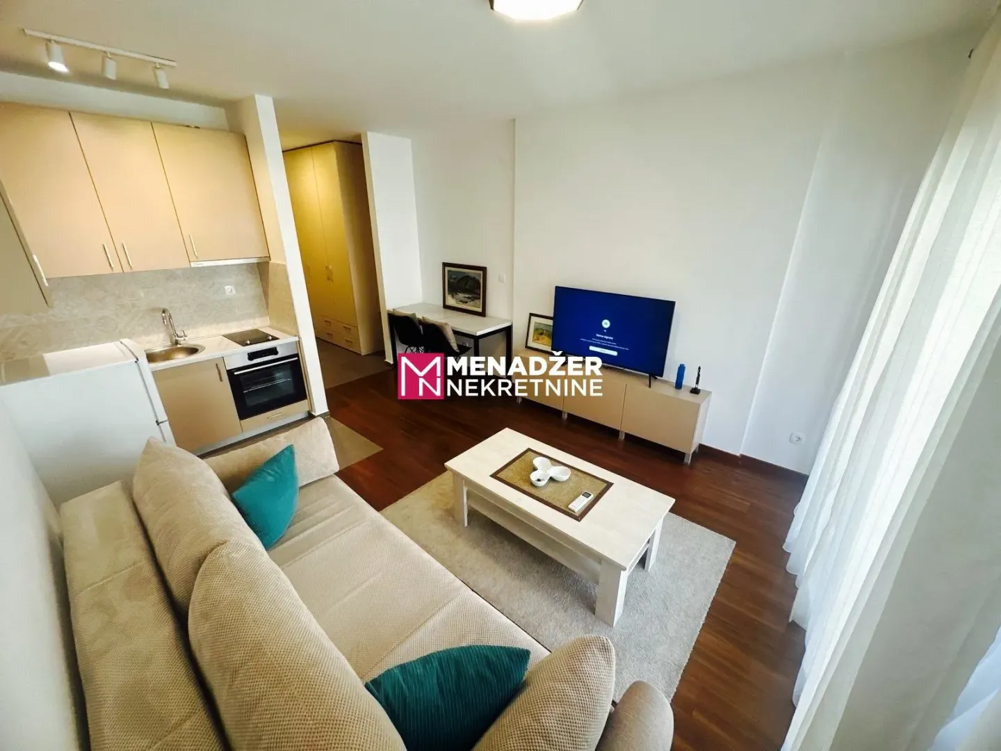 Living room connected with kitchen and dining area.