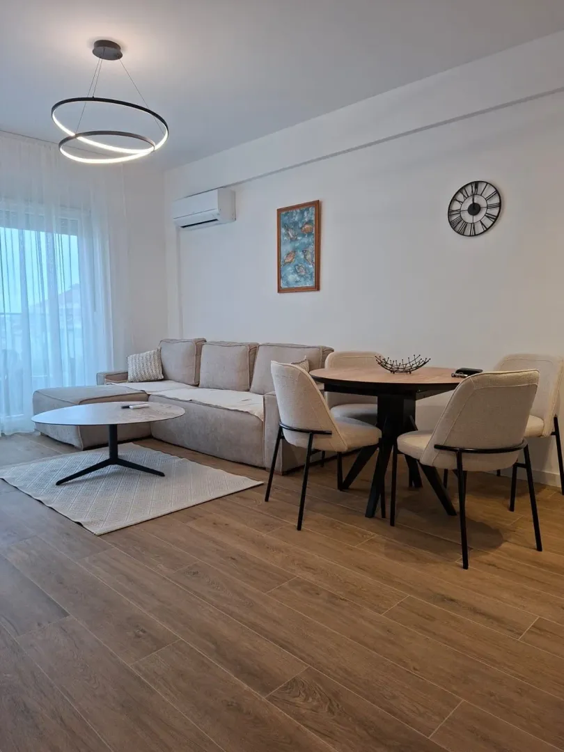 Living room with a sofa and dining table.
