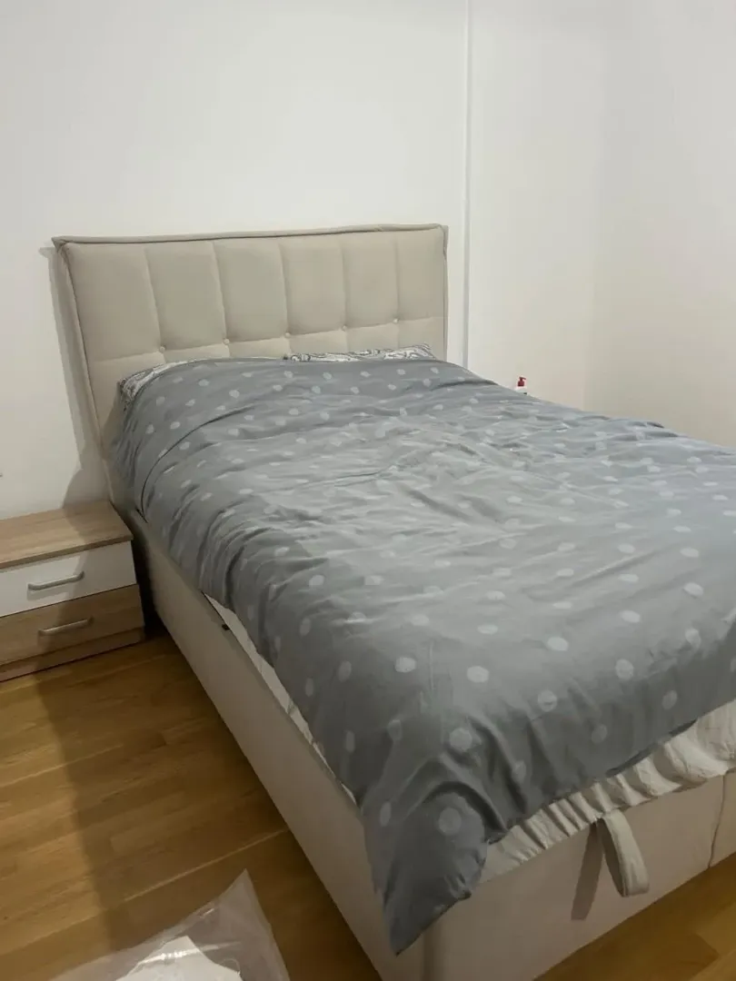 Bedroom with a double bed and a nightstand.