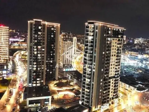 Night view of illuminated modern residential buildings and the surrounding city. - image 11