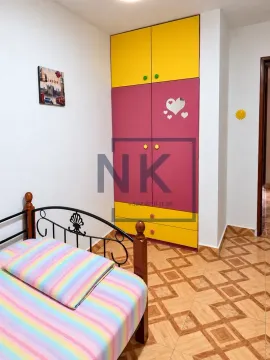 Children's bedroom with a bed and a colorful wardrobe. - image 12