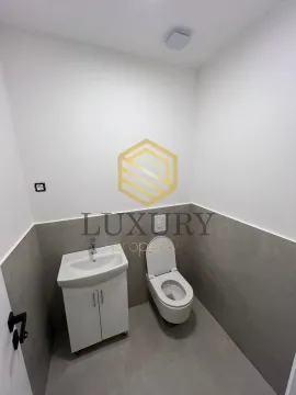 Small bathroom with a sink and toilet bowl. - image 5