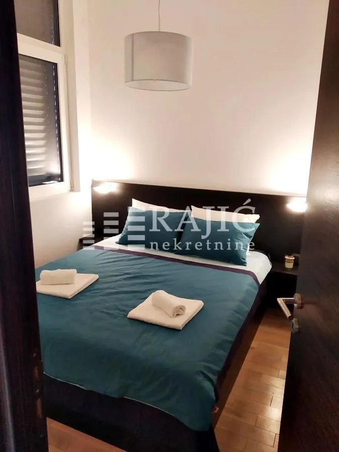 Furnished bedroom with a double bed.