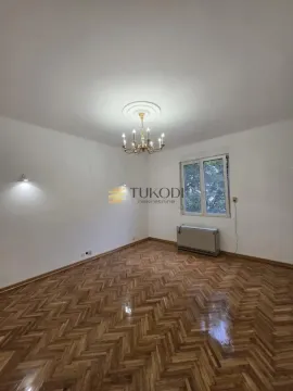 Empty room with parquet flooring and a window. - image 13