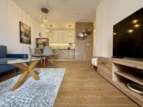 Living room with dining area and kitchen in an open space. - image 7