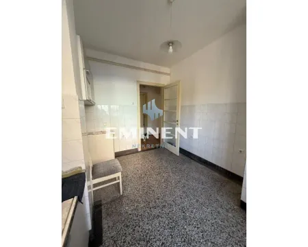 Small older kitchen with wall tiles and terrazzo flooring. - image 8
