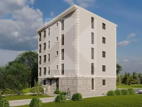 Spoljašnji izgled stambene zgrade sa uređenom okolinom. - image 3