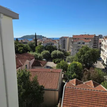 View from the terrace overlooking the town, neighborhood, and the sea in the distance. - image 3