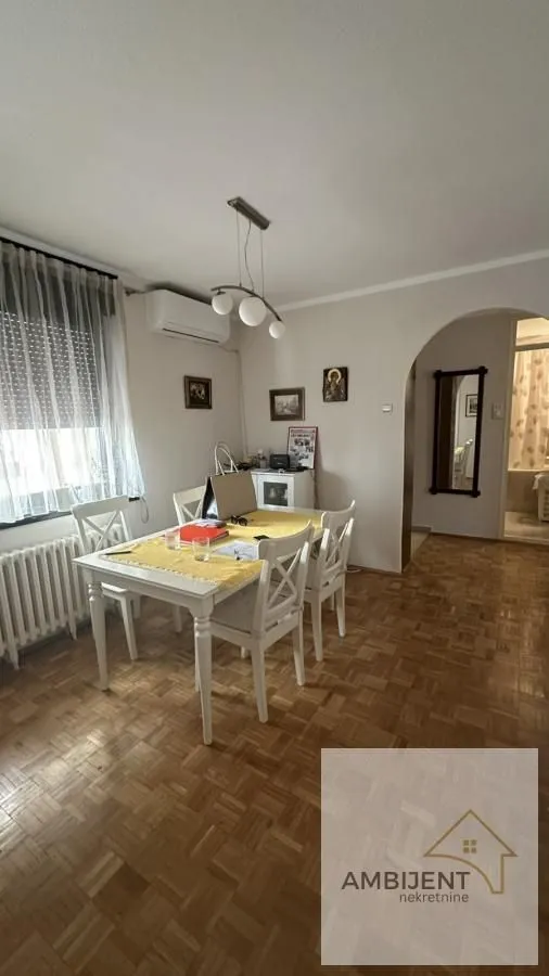 Dining area with a dining table and chairs within the living room space.