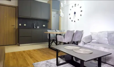 Modern living room with dining area and fitted kitchen. - image 2