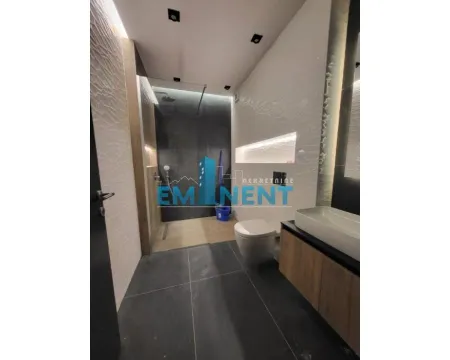Modernly equipped bathroom with a walk-in shower and washbasin. - image 13