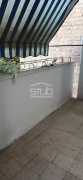 Smaller tiled balcony with railing and awning. - image 15