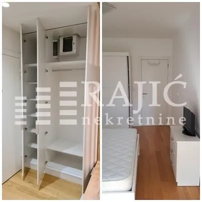 Bedroom with a built-in wardrobe and a bed.