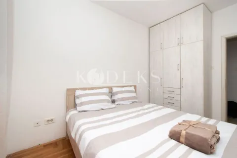 Bedroom with a double bed, white bedding, and a large wardrobe. - image 5