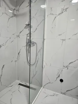 Modern tiles and shower cabin in the bathroom. - image 3
