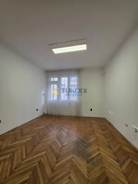 Empty room with hardwood flooring and white walls. - image 4