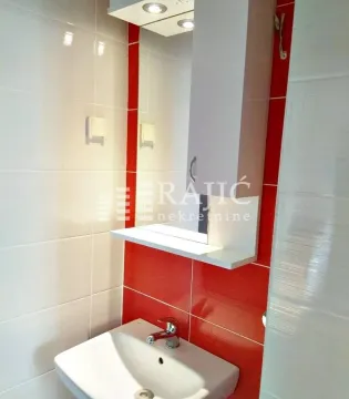 View of the sink and mirror in the bathroom. - image 18