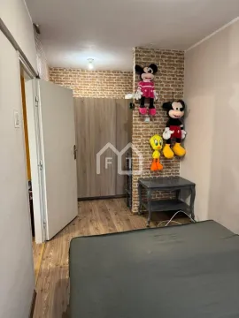 Children's bedroom with a bed, wardrobe, and toys on the wall. - image 13