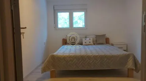 Bedroom with a double bed and a window. - image 5