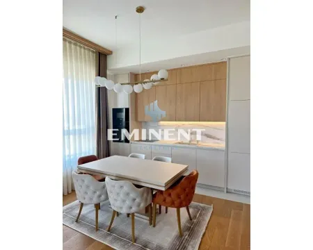 Modern kitchen with dining area and built-in elements. - image 4