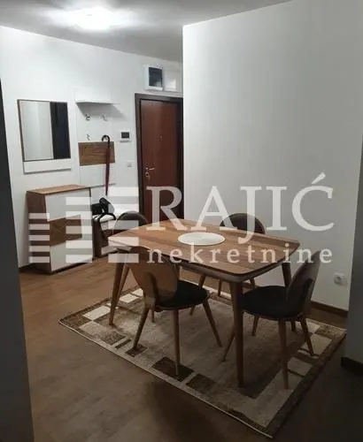 Living room with a dining table and chairs.