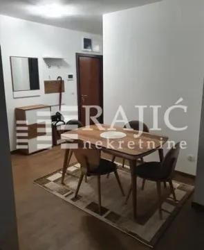 Living room with a dining table and chairs. - image 6