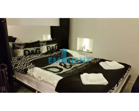 Bedroom with a large double bed and linens. - image 11