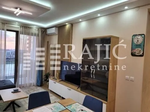 Living room with a sofa and dining table.