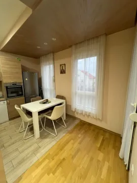 Kitchen with a dining table and windows. - image 6