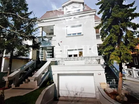 Exterior view of a multi-story house with a garage and stairs. - image 3