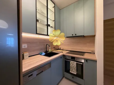 Modern kitchen with blue cabinets and a wooden countertop. - image 5