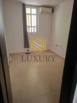 Empty room with floor tiles and an air conditioning unit on the wall. - image 2