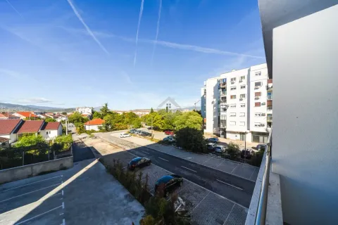 View from the balcony overlooking the street and surrounding buildings. - image 5