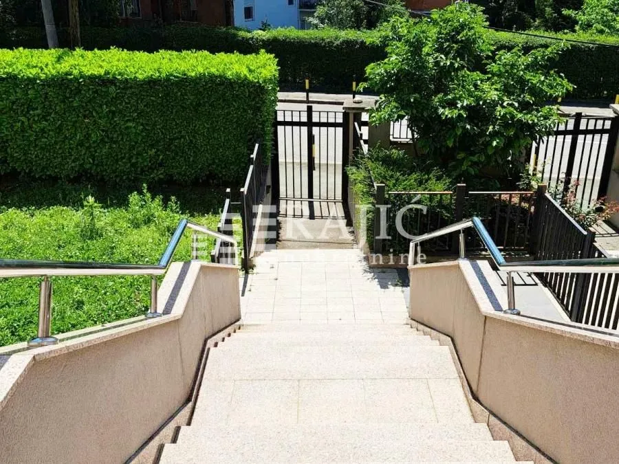 External stairs leading to the entrance gate and building yard.