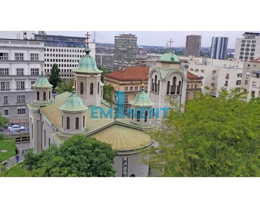 View from the window of the cityscape and a church.