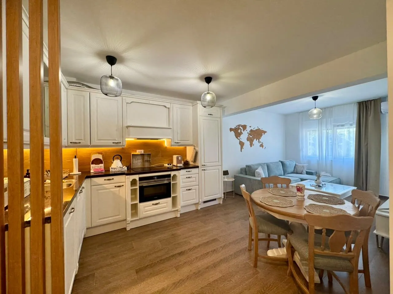 Modern kitchen with dining area and open view of the living room.