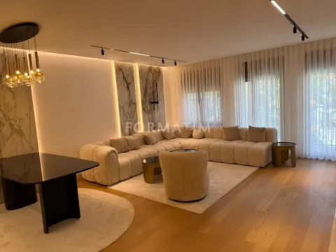 Modern living room with a sofa set, dining table, and recessed lighting. - image 18