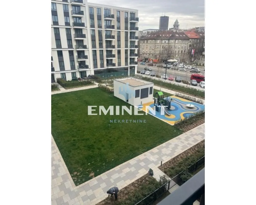 View from the terrace of the landscaped courtyard and children playground in front of the building.