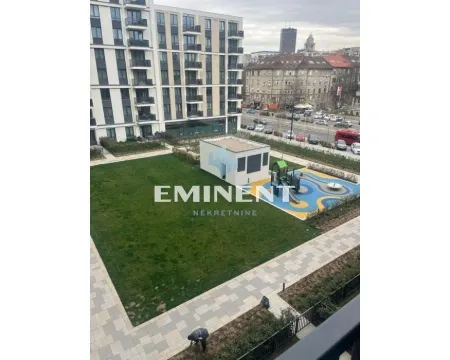 View from the terrace of the landscaped courtyard and children playground in front of the building. - image 16