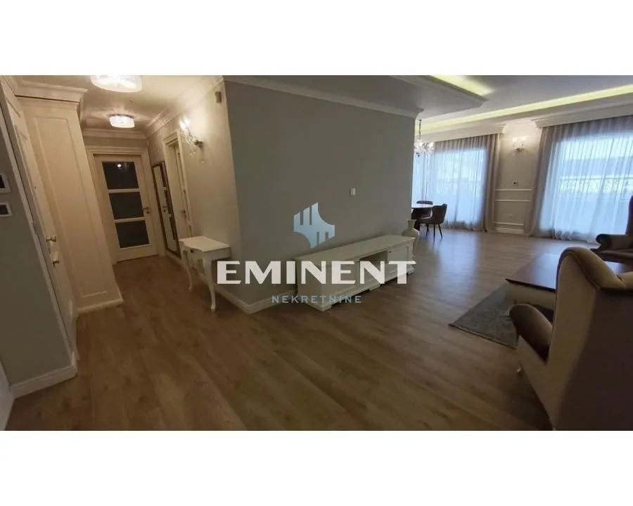 Spacious living room with a dining area and hallway.