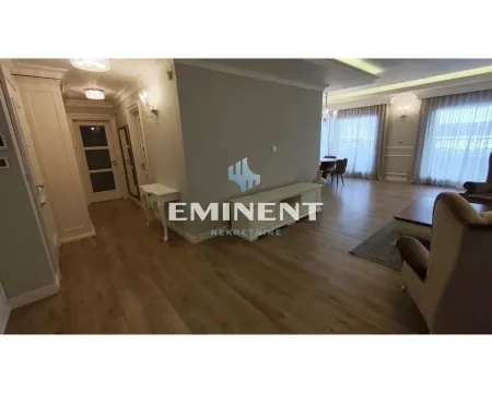 Spacious living room with a dining area and hallway. - image 4