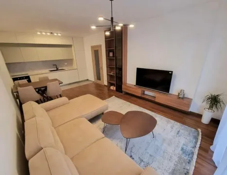 Spacious living room connected to the dining area and kitchen. - image 2