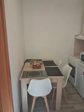 Dining table with chairs in the kitchen. - image 3