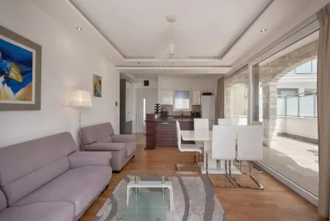 Spacious living room connected to the dining area and kitchen, with access to the terrace. - image 5