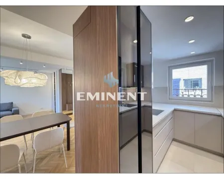Modern kitchen with built-in appliances connected to the dining area. - image 8
