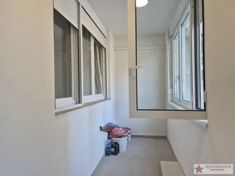 Glazed balcony with white walls and PVC windows. - image 9